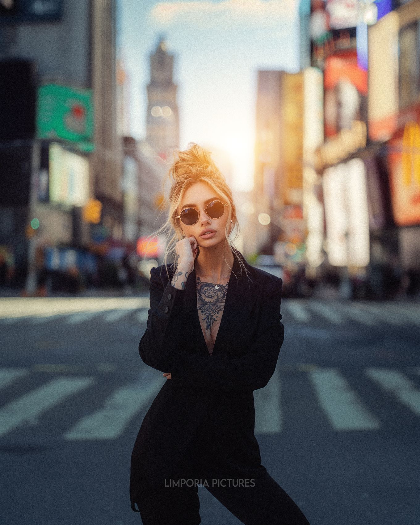 Limporia photo of an elegant woman in a black blazer and sungl a014c92b-22d7-4e51-a4b0-c21993971655