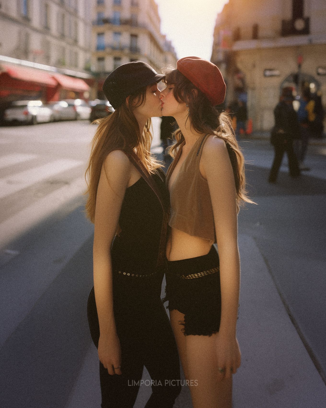 Limporia photograph of two beautiful women kissing in the city cc65eae7-d918-4c1d-a19f-2bc4ab273ca4